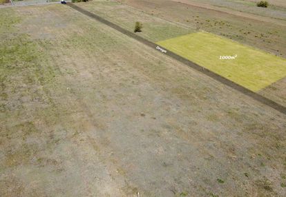 Działka inwestycyjna 1000m² –mała wieś przy drodze