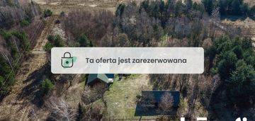 Na sprzedaż drewniany dom w lesie z działką 80 ar