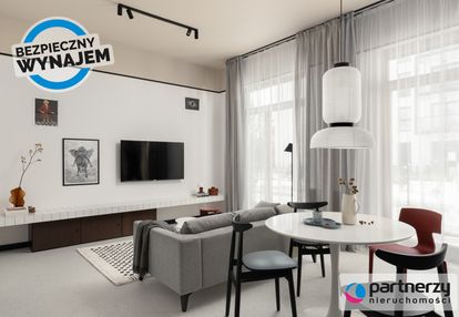 Designerskie mieszkanie z ogrókiem i halą garażową