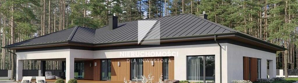 Działka budowlana otoczona lasem w pobliżu jeziora