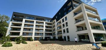 Nowe mieszkanie w apartamentowcu z własną plażą