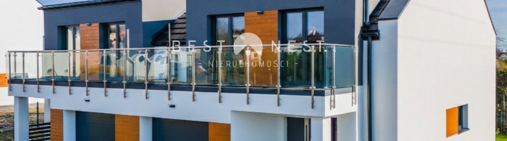 Nowoczesny dom z garażem w zabudowie bliźniaczej