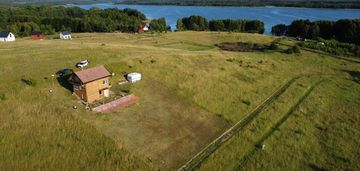 Przepięknie położona działka z domkiem całorocznym