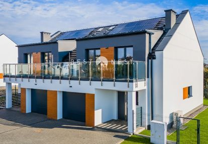 Nowoczesny dom z garażem w zabudowie bliźniaczej