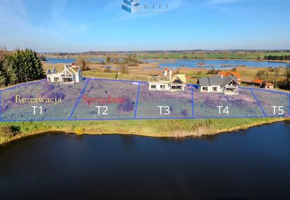 Dom zanurzony w warmińskim krajobrazie