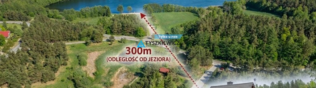 Urokliwy dom, otoczony drzewami, nad j.kamieniczno