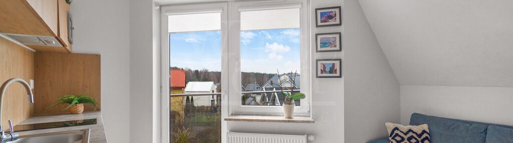 Dupoziomowy apartament z dwoma balkonami