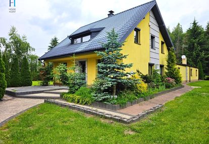 Dom w stanie surowym z pięknym ogrodem