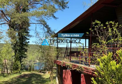 Domek w gołubiu z widokiem na jezioro dąbrowskie