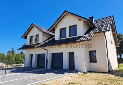 Dom w zabudowie bliźniaczej z garażem