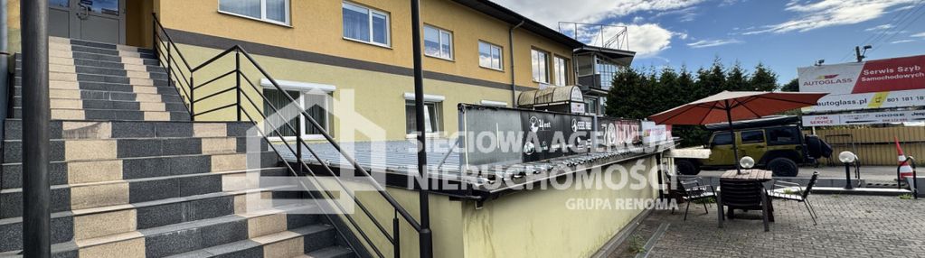 Inwestycyjny budynek przy głównej trasie