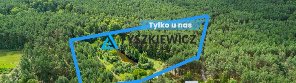 Działka z wz, blisko jeziora, otulona lasem.