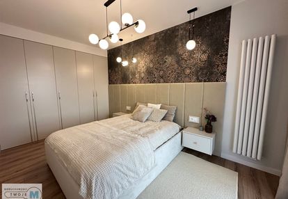 4 pokojowy apartament z 2 miejscami garażowymi.