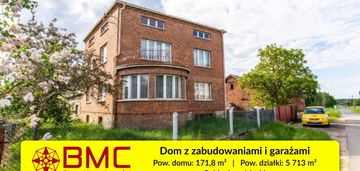 Dom z zabudowaniami i garażami pod działalność gos