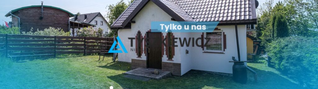 Dom z linią brzegową jeziora dzierzgoń