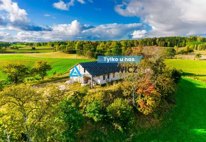 Działka z rozpoczętą budową domu w ciemnie
