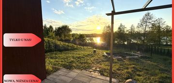 Działka nad jeziorem raciąskim z domkiem.