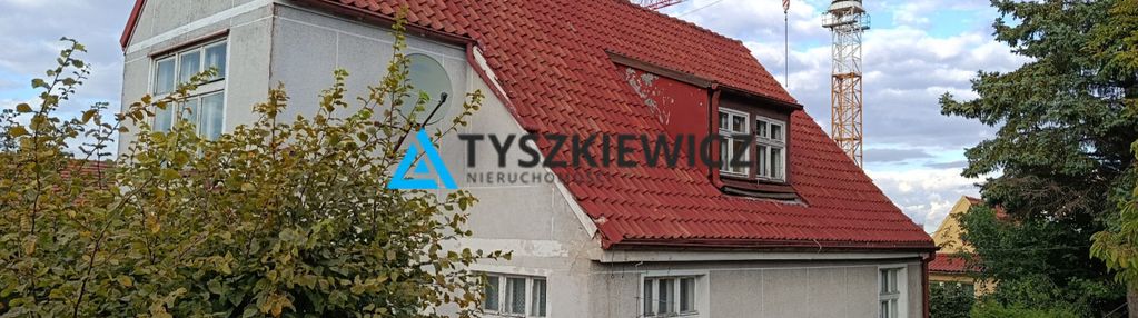 Dom z ogrodem na szczycie wzgórza