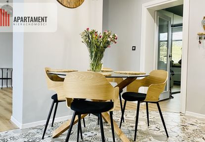 Luksusowe mieszkanie w domu z garażem i ogrodem.