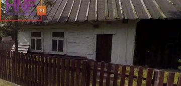 Działka z drewnianym domem blisko jeziora