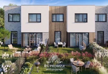 Piękny dom z garażem na zielonych maślicach