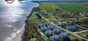 Twój azyl nad zatoką – ogród, szum fal i cisza