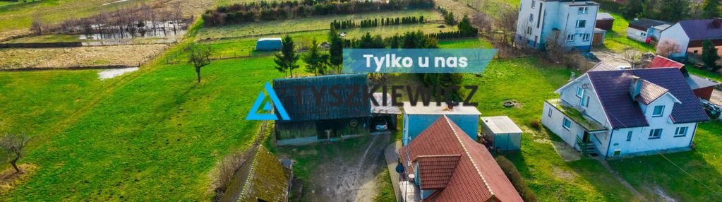 Dom z budynkami gospodarczymi nad j. gowidlińskim