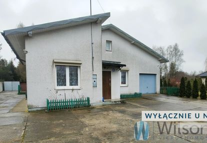 Dom parterowy na zielonej działce z lasem i stawem