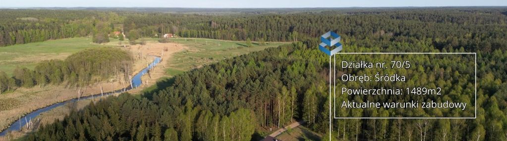 Działka otoczona lasami - śródka
