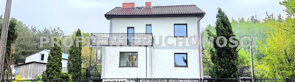 Podpiwniczony dom z garażem i ogrodem