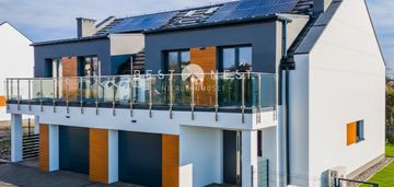 Nowoczesny dom z garażem w zabudowie bliźniaczej