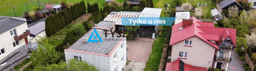 Dom mieszkalny z budynkami pod usługi.