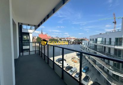 Apartament nad odrą z tarasem i widokiem na rzekę.