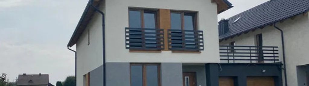 Nowoczesny dom w zabudowie bliźniaczej z garażem