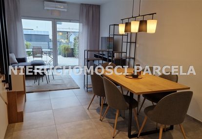 Komfortowy dwupoziomowy apartament  z ogródkiem