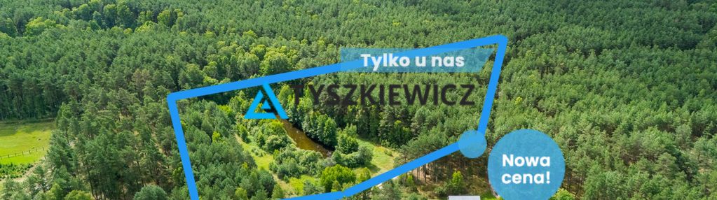 Działka z wz, blisko jeziora, otulona lasem.