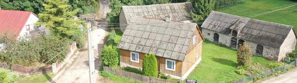 Drewniany dom z dodatkową działką