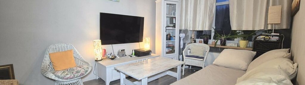 Mieszkanie z garderobą, ogródkiem i garażem.