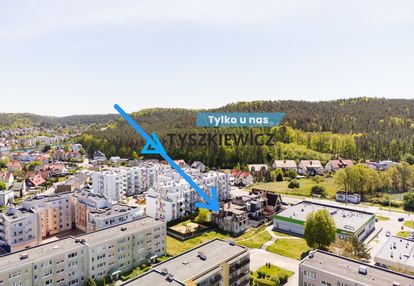 Działka z budynkiem w stanie surowym