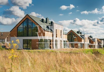 Domy przy jeziorze, tuchom