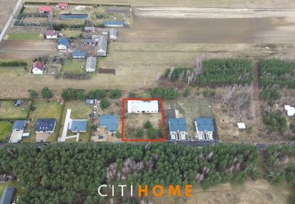 **działka z budynkiem gospodarczym**