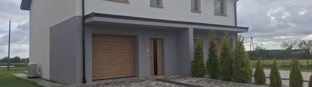 Nowy dom z garażem na słonecznej działce