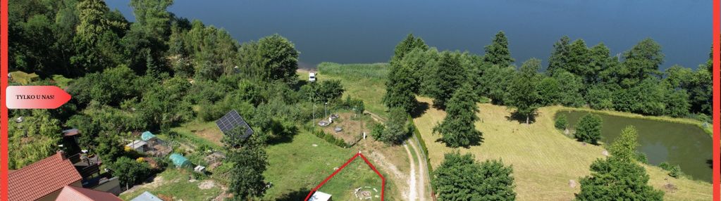 Działka nad jeziorem raciąskim z domkiem.