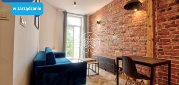 Kawalerka z balkonem w dzielnicy muzycznej