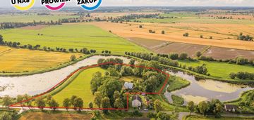 Działka z domem  z 40 metrową linią brzegową rzeki