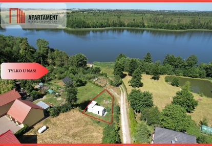 Działka nad jeziorem raciąskim z domkiem.