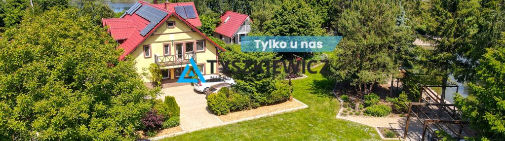Dom nad rzeką z własną przystanią