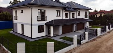 Połówka bliźniaka z garażem na 2 samochody