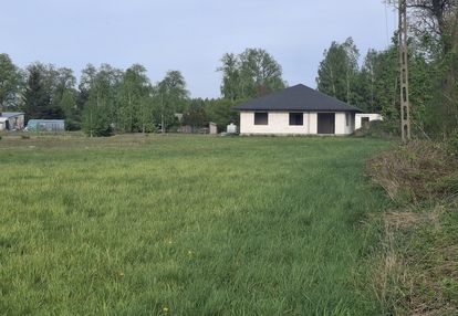 Działka budowlana z domem w stanie surowym